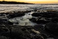 Sunrise on Tide Pools and Pahoehoe Lava On Punalu\'u Beach Royalty Free Stock Photo