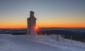 Sunrise time, stone column with height quota 1603 m in snezka, mountain on the border between Czech Republic and Poland, winter