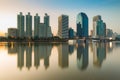 Sunrise tone over office building with water reflection Royalty Free Stock Photo