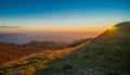 Sunrise from the top of a mountain with reddish rays of the sun Royalty Free Stock Photo