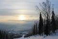 Sunrise on top of a mountain with slopes for skiers, snowboarders Royalty Free Stock Photo