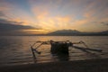 Sunrise with tourist boat and still water on Gili Air Island, In