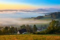 Sunrise, town and mountains in the fog, beautiful landscape Royalty Free Stock Photo