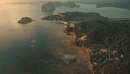 Sunrise at tropical ocean bay islands aerial view. Mountainous islet with exotic plants, forest