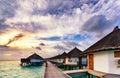 Sunrise of typical luxury overwater villa