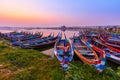 Sunrise at U Bein Bridge with boat, Mandalay, Myanmar.