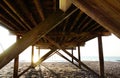 Sunrise under the pier in Carolina Beach , NC Royalty Free Stock Photo