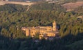 Sunrise view of the Abbey of Monte Oliveto Maggiore, a large Benedictine monastery in Tuscany, Italy