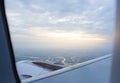 Sunrise view from airplane window on passenger seat Royalty Free Stock Photo