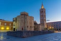 Sunrise view of Bell tower between Saint Donatus church and Saint Anastasia cathedral in Zadar, Croatia Royalty Free Stock Photo