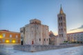 Sunrise view of Bell tower between Saint Donatus church and Saint Anastasia cathedral in Zadar, Croatia Royalty Free Stock Photo