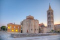 Sunrise view of Bell tower between Saint Donatus church and Saint Anastasia cathedral in Zadar, Croatia Royalty Free Stock Photo