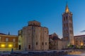 Sunrise view of Bell tower between Saint Donatus church and Saint Anastasia cathedral in Zadar, Croatia Royalty Free Stock Photo