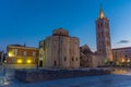 Sunrise view of Bell tower between Saint Donatus church and Saint Anastasia cathedral in Zadar, Croatia Royalty Free Stock Photo