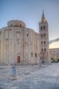 Sunrise view of Bell tower between Saint Donatus church and Saint Anastasia cathedral in Zadar, Croatia Royalty Free Stock Photo