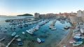 Sunrise view of boats mooring in the old port of Dubrovnik, Croatia Royalty Free Stock Photo