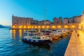 Sunrise view of boats mooring in the old port of Dubrovnik, Croatia Royalty Free Stock Photo