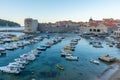 Sunrise view of boats mooring in the old port of Dubrovnik, Croatia Royalty Free Stock Photo