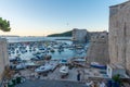 Sunrise view of boats mooring in the old port of Dubrovnik, Croatia Royalty Free Stock Photo