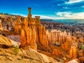 Thors\'s Hammer the the Three Sisters at sunrise at Sunset Point in Bryce Canyon Nationa Park in Utah Royalty Free Stock Photo