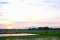 sunrise view l, with mountains on the edge of rice fields in the morning Royalty Free Stock Photo