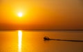 Sunrise view of a lone boat on the Qiantang River, Haining, China Royalty Free Stock Photo