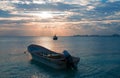 Sunrise View of Mexican Fishing Boat and ponga / skiff in Puerto Juarez Harbor of Cancun Bay Royalty Free Stock Photo