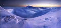 Sunrise view of Pec pod Snezkou in the Krkonose Mountains in winter. Czech Republic. Morning panoramic view above clouds. Royalty Free Stock Photo