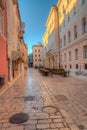 Sunrise view of a pedestrian street in the old town of Zadar, Croatia Royalty Free Stock Photo