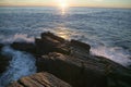 Sunrise view of rocky coastline near Portland Head Lighthouse, Cape Elizabeth, Maine