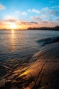 Sunrise in Vita Sandar bay, sandy beach with rocks in sweden