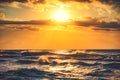 Beautiful cloudscape over the golden sunrise sea wave Royalty Free Stock Photo