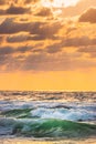 Beautiful green sunrise wave and dramatic sky with fluffy clouds