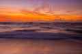 Sunrise on The Waves and The Sandy Shore of Lydgate Beach