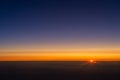 Sunrise from the window of the plane Royalty Free Stock Photo