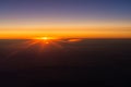 Sunrise from the window of the plane Royalty Free Stock Photo