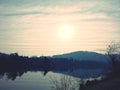 Sunrise during winter over river with tree line Royalty Free Stock Photo