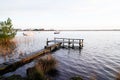 Sunrise wood access fishing boat wooden pontoon in sunset Lake Hourtin in Gironde france Royalty Free Stock Photo