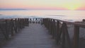 Sunrise on the wooden boardwalks of the beach