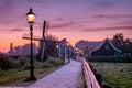 Sunrise Zaanse Schand Dutch windmill village, Windmill village Zaanse Schans, green wooden house at the windmill village