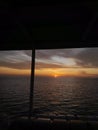 Sunrisein the middle of the sea boat Royalty Free Stock Photo