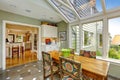 Sunroom patio area with dining table set