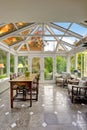 Sunroom patio area with transparent vaulted ceiling Royalty Free Stock Photo