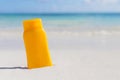 Sunscreen cream bottle on the beach Royalty Free Stock Photo