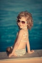 Sunscreen lotion drawing sun Royalty Free Stock Photo