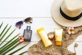 Sunscreen spf50 ,body lotion crochet ,flowers frangipani ,sunglasses ,hat and perfume Royalty Free Stock Photo