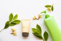 Sunscreen spf50  cosmetics health care for skin face, body lotion and yellow flowers frangipani Royalty Free Stock Photo