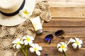 Sunscreen spf50  cosmetics health care for skin face with crochet ,flowers frangipani ,sunglasses ,hat of lifestyle Royalty Free Stock Photo