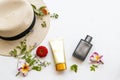 Sunscreen spf50 cosmetics health care for skin face with hat ,perfume and flower frangipani ,zinnia