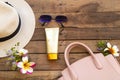 Sunscreen spf50  cosmetics health care for skin face with pink hand bag sunglasses ,hat Royalty Free Stock Photo